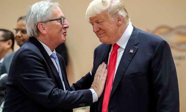 U.S. President Donald Trump, right, talks with European Commission President Jean-Claude Juncker, left, prior to a working session at the G-20 summit in Hamburg, Germany, July 8, 2017. REUTERS/Michael Kappeler, Pool