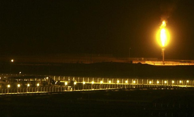 FILE PHOTO: Shaybah oilfield complex is seen at night in the Rub' al-Khali desert, Saudi Arabia, November 14, 2007. REUTERS/Ali Jarekji/File Photo
