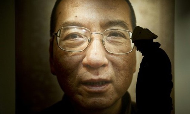 © AFP/File | A poster of Chinese Nobel Peace laureate Liu Xiaobo in Oslo in 2010
