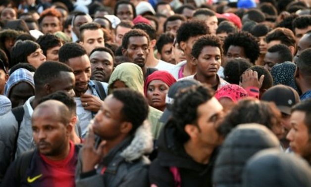 © AFP/File | Migrants and refugees being evacuated from a makeshift camp in northern Paris. France received 85,000 asylum requests last year
