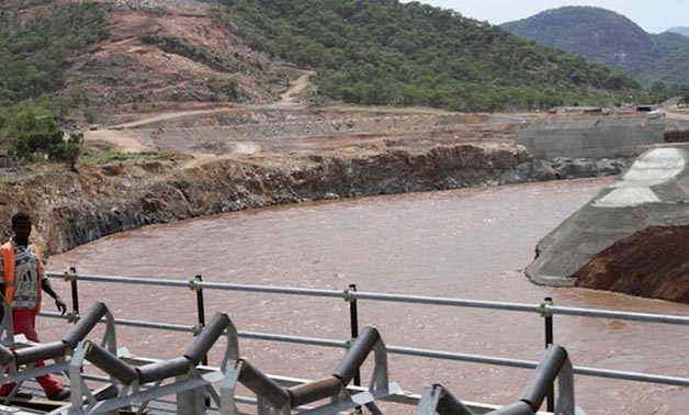 A man walks over a bridge by the construction of Ethiopia's Great Renaissance Dam in Guba Woreda, June 28, 2013 - REUTERS/Tiksa Negeri 