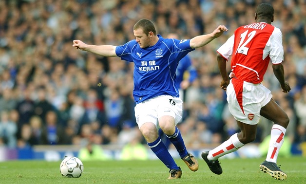 Rooney spins towards goal with his second touch as Lauren and Arsenal back off. . 