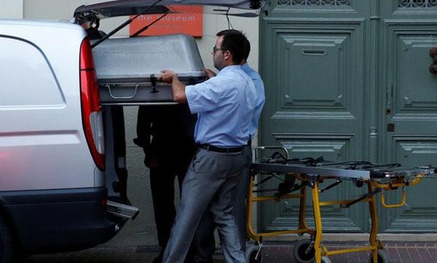 Workers carry a coffin to be used during the exhumation of Spanish artist Salvador Dali, in order to obtain DNA samples following a paternity claim, at Teatre-Museu Dali (Theater-Museum Dali) in Figueras city, Spain, July 20, 2017.