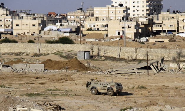 In this Nov. 6, 2014, file photo, an Egyptian armored vehicle is seen on the Egyptian side of the border across from Rafah in north Sinai. (Ahmed Abd El Latif, El Shorouk Newspaper/AP)