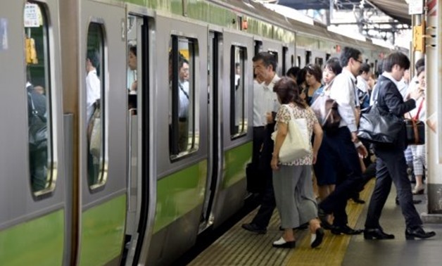 © AFP | The scene at a Tokyo train station as Japan launches an exercise to encourage commuters to work from home in the run-up to the summer Olympics in 2020
