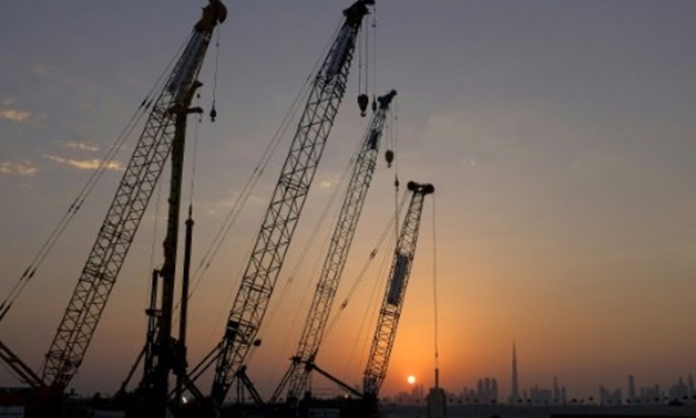 © AFP/File | Construction cranes are seen during a groundbreaking ceremony for The Tower at Dubai Creek Harbour on October 10, 2016
