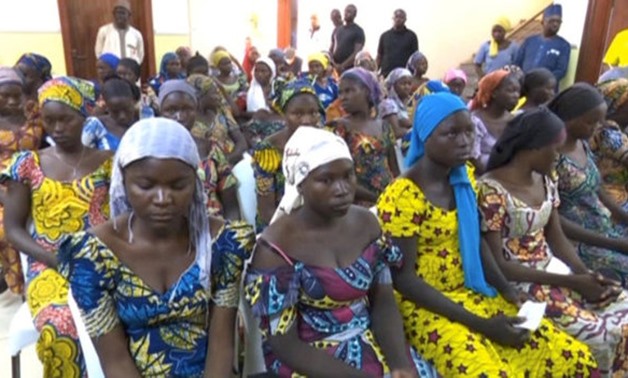 FILE PHOTO - A still image taken from video shows a group of girls, released by Boko Haram jihadists after kidnapping them in 2014 in the north Nigerian town of Chibok, sitting in a hall as they are welcomed by officials in Abuja, Nigeria, May 7, 2017. RE