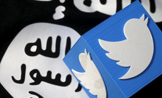 A 3D printed logo of Twitter and an Islamic State flag are seen in this picture illustration taken February 18, 2016. Reuters