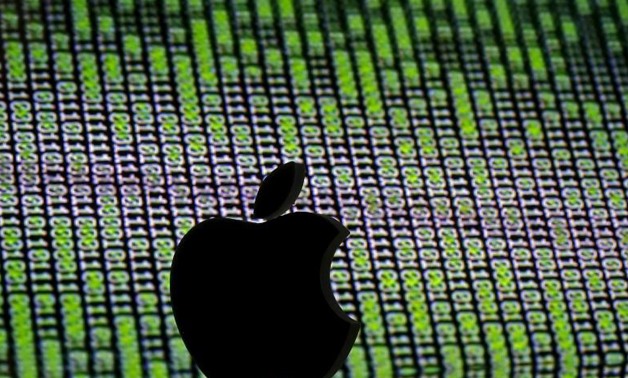 FILE PHOTO: A 3D printed Apple logo is seen in front of a displayed cyber code in this illustration taken March 22, 2016.
Dado Ruvic/Illustration