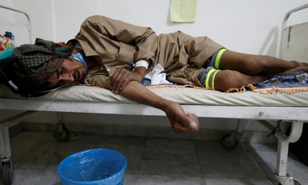 A man lies on the bed of a cholera treatment center in Sanaa, Yemen, May 15, 2017. REUTERS