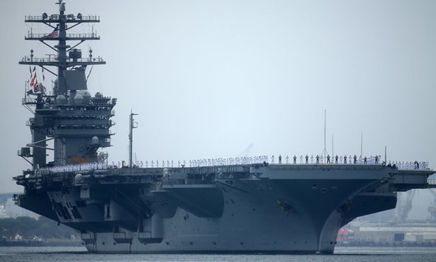 Sailors man the rails as aircraft carrier USS Nimitz with Carrier Strike Group 11, and some 7,500 sailors and airmen depart for a 6 month deployment in the Western Pacific from San Diego, California, U.S., June 5, 2017. REUTERS