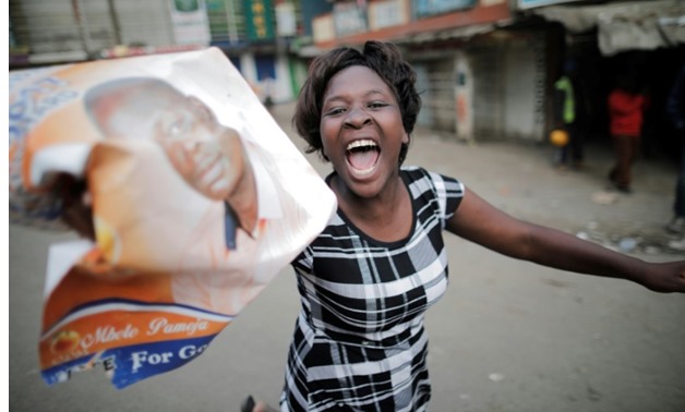 Opposition supporters streamed through Nairobi's Mathare slum on Thursday, shouting 'Uhuru must go' - AFP