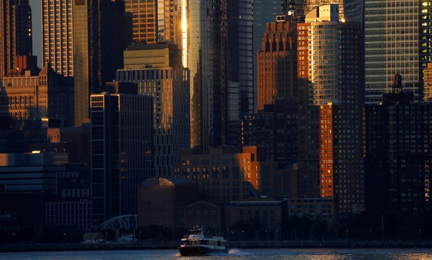 A ferry crosses the Hudson River at sunrise in front of lower Manhattan in NewYork City, as seen from Hoboken, New Jersey, U.S., August 9, 2017.
Mike Segar