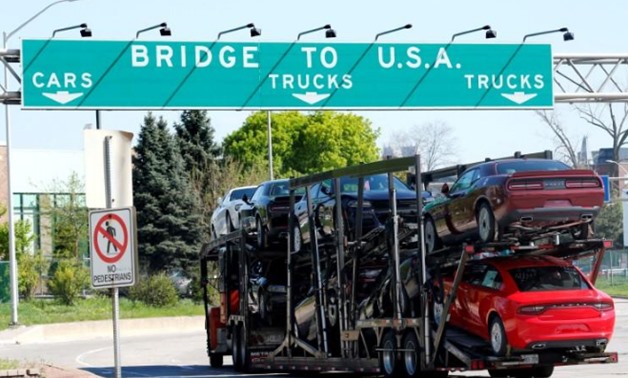  A car hauler heading for Detroit, Michigan, drives on the lane to Ambassador Bridge - Reuters