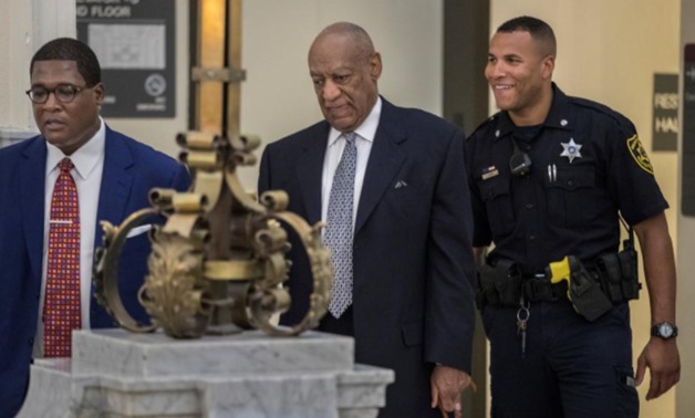 ndrew Wyatt, left, guides Bill Cosby into Courtroom A at the Montgomery County Courthouse in Norristown, Pennsylvania., U.S.