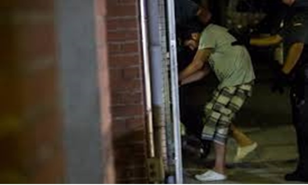 Spanish Civil Guards escort one of four men accused of involvement in an Islamist cell behind a van attack in Barcelona last week, in Tres Cantos, Spain, August 21, 2017 - REUTERS