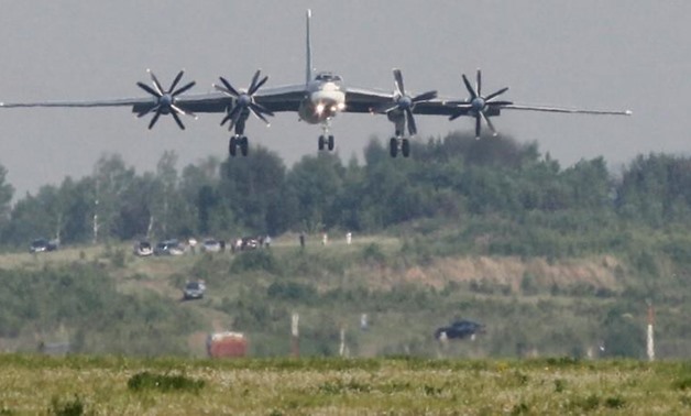 A Tupolev Tu-95MS strategic bomber, the carrier of nuclear rockets, lands at the Yemelyanovo airport near Russia's Siberian city of Krasnoyarsk, June 8, 2011.
Ilya Naymushin