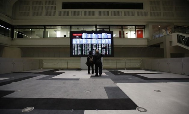 File Photo: Visitors looks at an electronic board showing the Japan's Nikkei average at the Tokyo Stock Exchange (TSE) in Tokyo, Japan, February 9, 2016.
Issei Kato