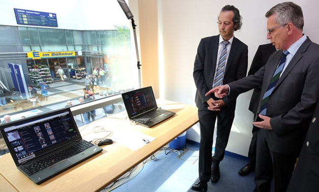 German Interior Minister Thomas de Maiziere is briefed on the facial recognition technology project at the Suedkreuz trainstation in Berlin, Germany, August 24, 2017. REUTERS