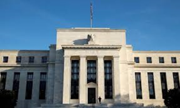 FILE PHOTO - A police officer keeps watch in front of the U.S. Federal Reserve in Washington, DC, U.S. on October 12, 2016.
Kevin Lamarque/File Photo