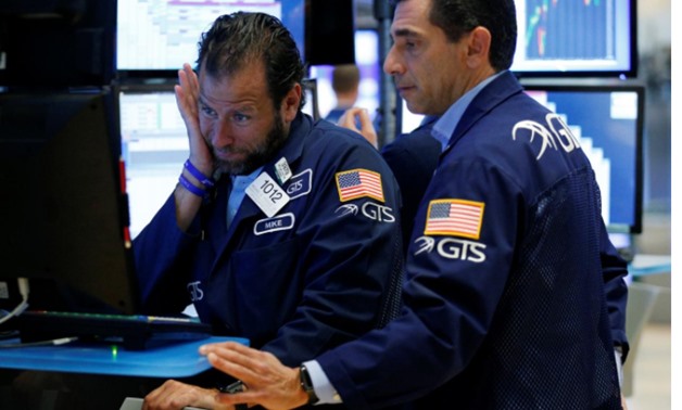 Traders work on the floor of the New York Stock Exchange (NYSE) in New York