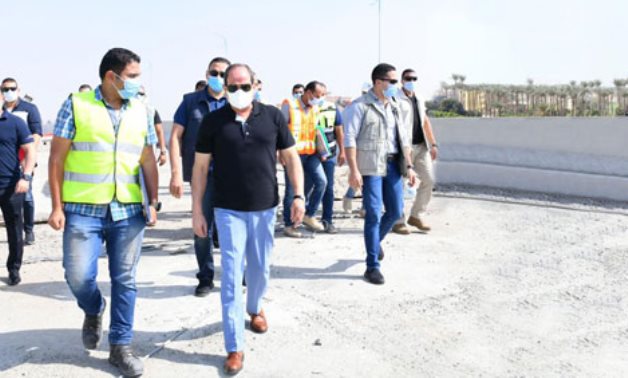 File- President Abdel Fattah El-Sisi inspected a number of projects to develop road networks in Greater Cairo in October 2020- press photo