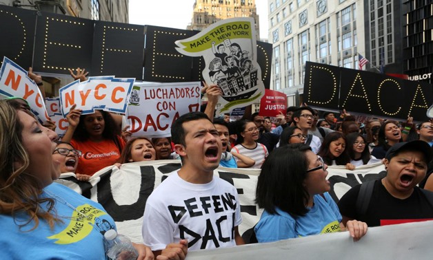 People march and chant slogans against U.S. President Donald Trump's proposed end of the DACA program that protects immigrant children from deportation at a protest in New York City, U.S., August 30, 2017. REUTERS/Joe Penney