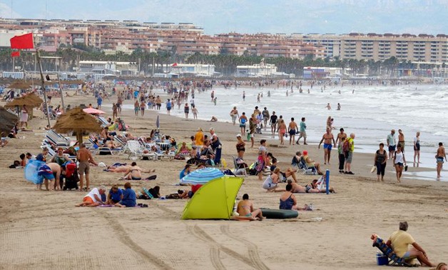 People enjoy the beach as the number of tourists in Spain reached new record levels, according to government sources, in Valencia, Spain September 1, 2017. REUTERS/Heino Kalis