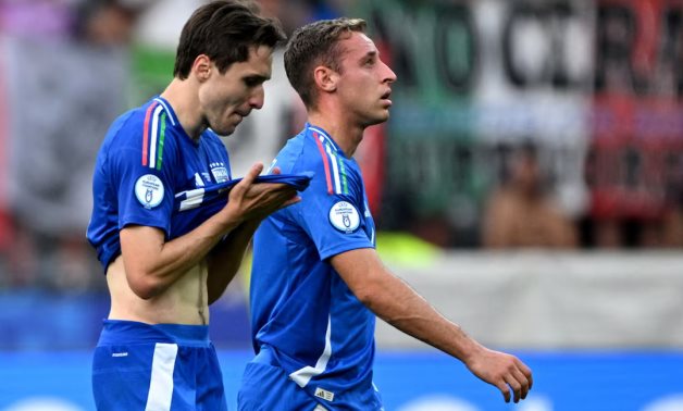 Italy's Federico Chiesa and Davide Frattesi look dejected after the match REUTERS/Annegret Hilse 