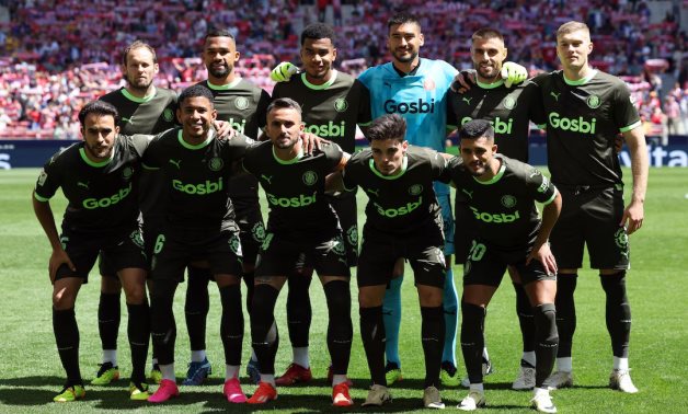 Girona players pose for a team group photo before the match REUTERS/Violeta Santos Moura/File Photo