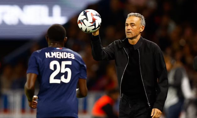 Paris St Germain coach Luis Enrique with Nuno Mendes REUTERS/Abdul Saboor/File Photo