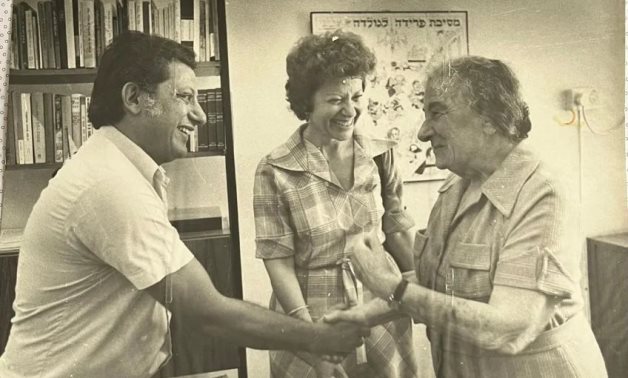 FILE - Robert Dessa shakes hands with then-Prime Minister of Israel Golda Meir