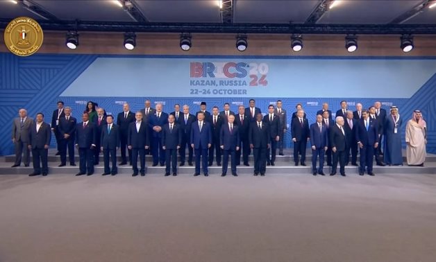 Egypt’s President Abdel Fattah El-Sisi and world leaders pose for a photo ahead of the BRICS Plus summit in Russia’s Kazan – Presidency/still image