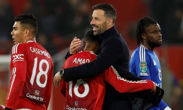 Manchester United interim manager Ruud van Nistelrooy celebrates with Amad Diallo after the match Action Images via Reuters/Jason Cairnduff