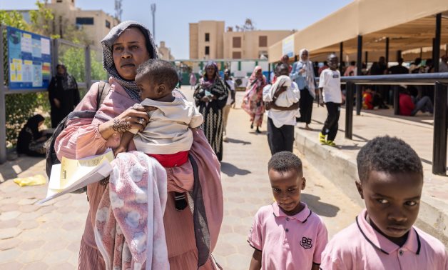 Elham and her children have recently arrived from Sudan, and are registering with UNHCR Egypt as asylum-seekers. UNHCR/Pedro Costa Gomes.