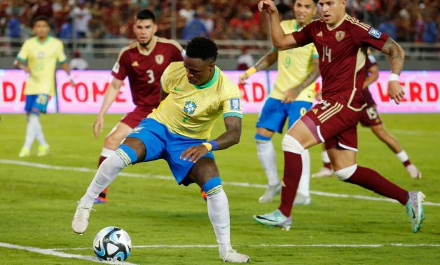 Brazil's Vinicius Junior in action with Venezuela's Ruben Ramirez REUTERS/Leonardo Fernandez Viloria