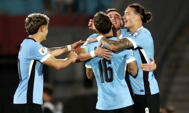 Uruguay's Manuel Ugarte celebrates scoring their third goal with teammates REUTERS/Mariana Greif