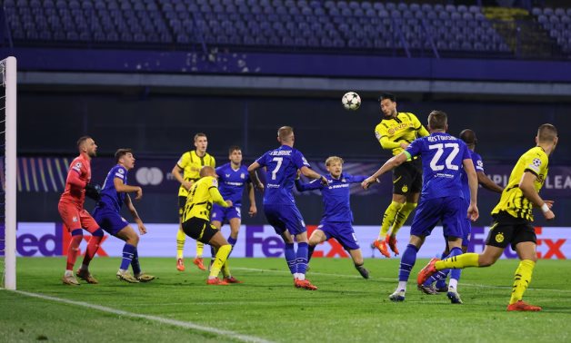 Borussia Dortmund's Ramy Bensebaini scores their second goal REUTERS/Antonio Bronic 