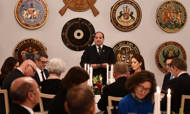 President Abdel Fattah El-Sisi signs the distinguished visitors' guestbook at the Danish Parliament, 7 December 2024 - Presidency