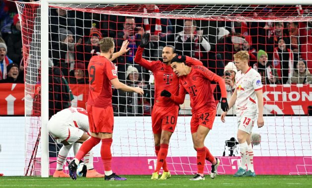 Bayern Munich's Jamal Musiala celebrates scoring their first goal with teammates REUTERS/Angelika Warmuth