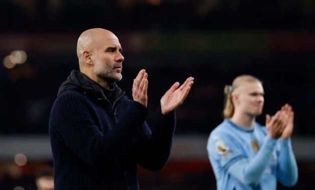 Manchester City manager Pep Guardiola and Erling Haaland applaud fans after the match Action Images via Reuters/Peter Cziborra/File Photo