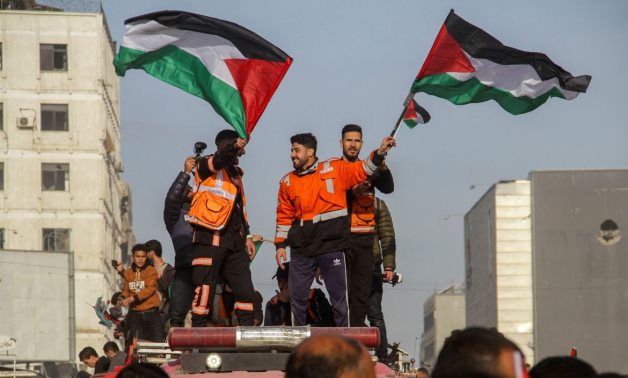 People in Gaza celebrate as the ceasefire in Gaza takes effect on Sunday, 19 January