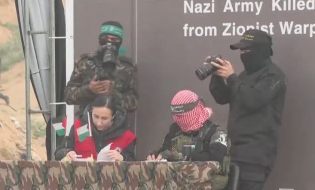 The Red Cross team signed documents on receiving the bodies of the four Israeli captives from Hamas amid a large public presence