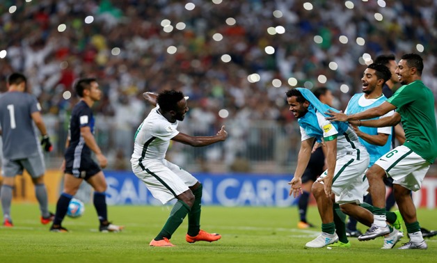 Fahd El Mowalad celebrates Saudi Arabian victory with teammates, Reuters