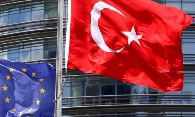 European Union (L) and Turkish flags fly outside a hotel in Istanbul - REUTERS