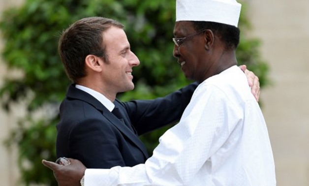  French President Emmanuel Macron (L) greets Chad's President Idriss Deby upon his arrival at the Elysee Presidential Palace in Paris on July 11, 2017.