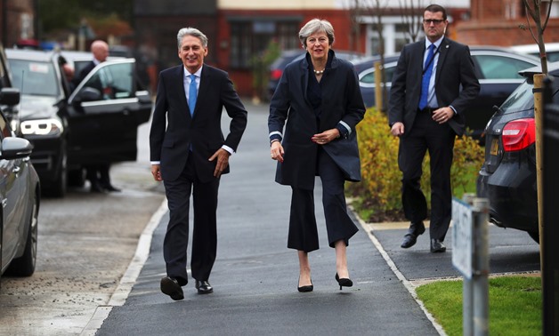 Britain's Prime Minister Theresa May and Chancellor of the Exchequer Philip Hammond visit a home near the Conservative Party's conference in Manchester, October 2, 2017. REUTERS/Hannah McKay

