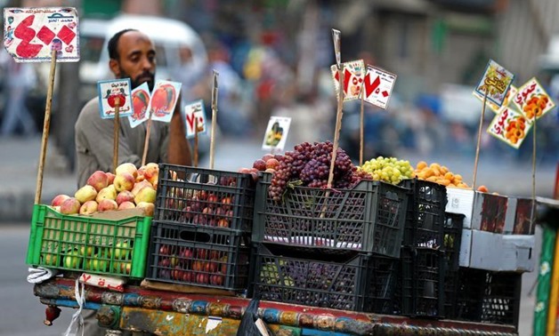 An Egyptian fruit seller is seen at a market in Cairo, Egypt June 18, 2017. Picture taken June 18, 2017. REUTERS/Mohamed Abd El Ghany