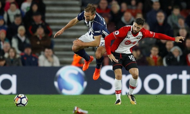 West Bromwich Albion's Craig Dawson in action with Southampton's Charlie Austin - REUTERS