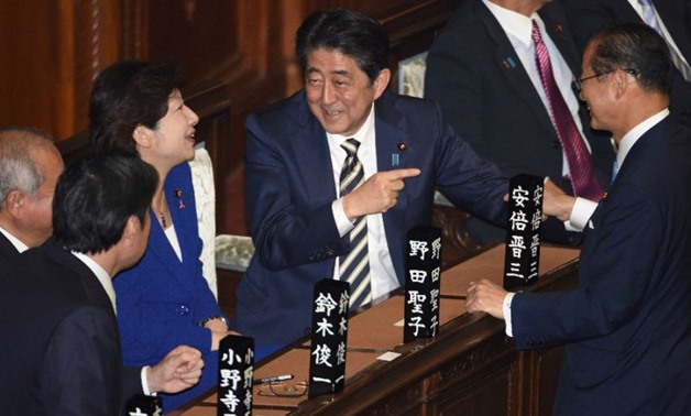 Japan MPs re-elect Abe after election landslide. AFP • October 31, 2017. Japanese Prime Minister Shinzo Abe (C) chats with colleagues in the lower house of
